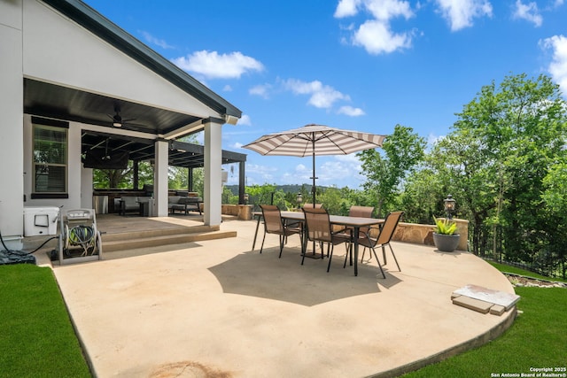 view of patio / terrace featuring a ceiling fan and outdoor dining area