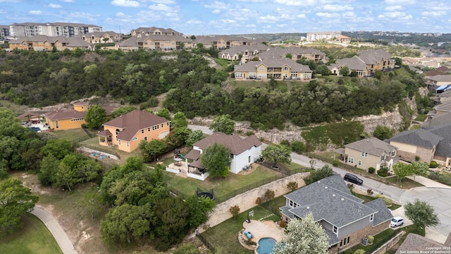 birds eye view of property with a residential view