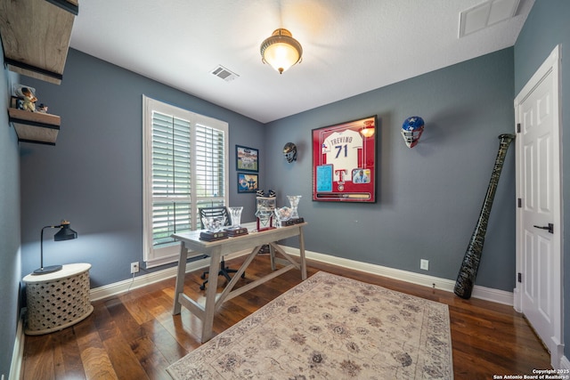 home office featuring baseboards, dark wood-style flooring, and visible vents