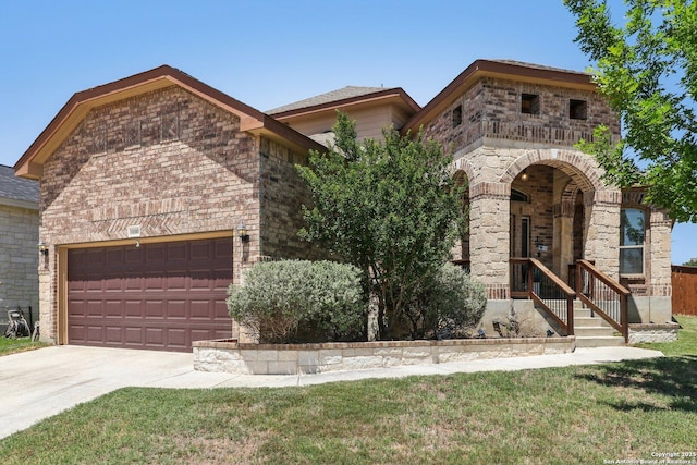 view of front of property featuring brick siding, an attached garage, driveway, and a front yard