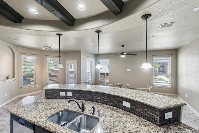kitchen with stainless steel dishwasher, a sink, visible vents, a ceiling fan, and light tile patterned floors