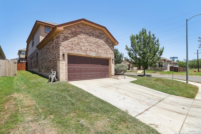 view of home's exterior with driveway, stone siding, an attached garage, fence, and a yard