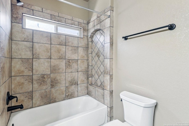 full bath featuring toilet and washtub / shower combination
