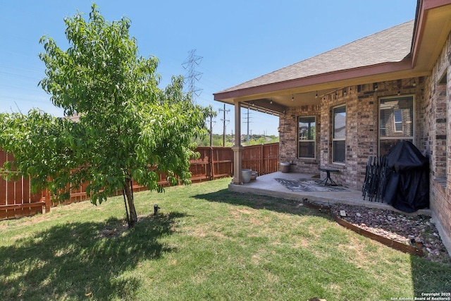 view of yard with a fenced backyard and a patio