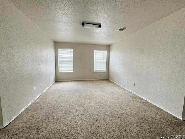 8755 Sunview Park, San Antonio, TX 78224 - empty room featuring a textured wall, a textured ceiling, and carpet floors