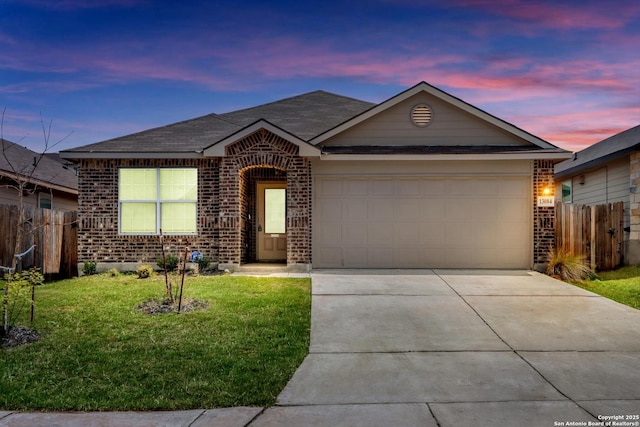 ranch-style house featuring brick siding, an attached garage, fence, and driveway