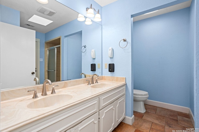 bathroom with visible vents, a stall shower, and a sink