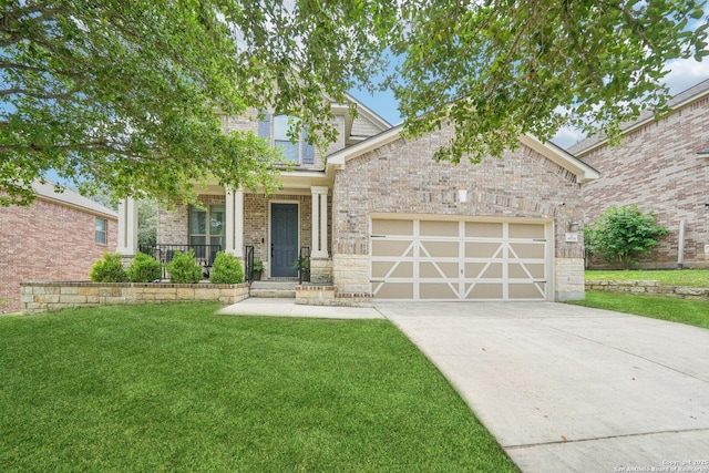view of front of house featuring a front lawn, driveway, covered porch, a garage, and brick siding