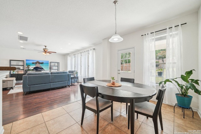 dining room featuring recessed lighting, visible vents, light tile patterned floors, a textured ceiling, and ceiling fan