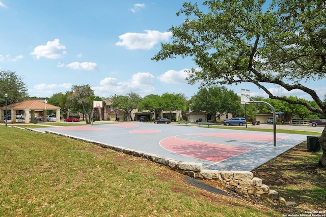 view of basketball court with a lawn, a gazebo, and community basketball court