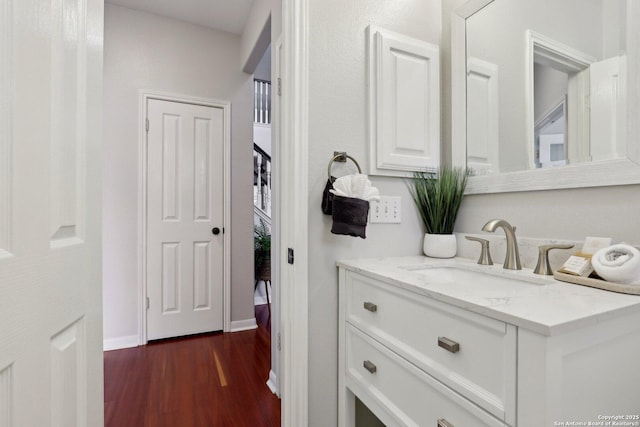 bathroom featuring wood finished floors and vanity