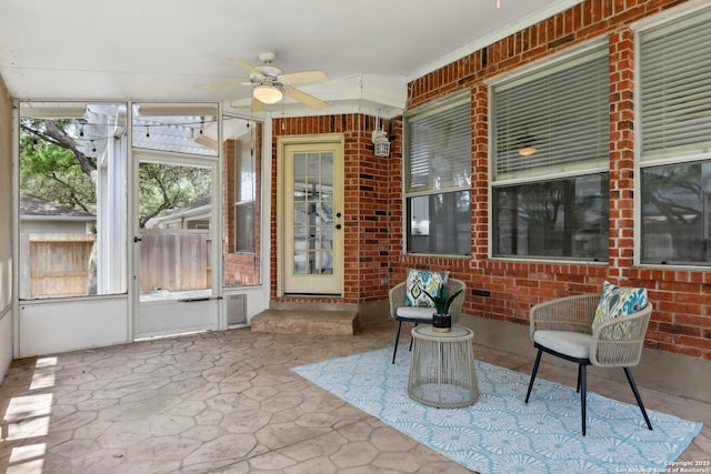 sunroom / solarium with ceiling fan