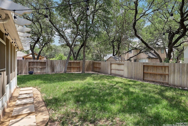 view of yard featuring a fenced backyard