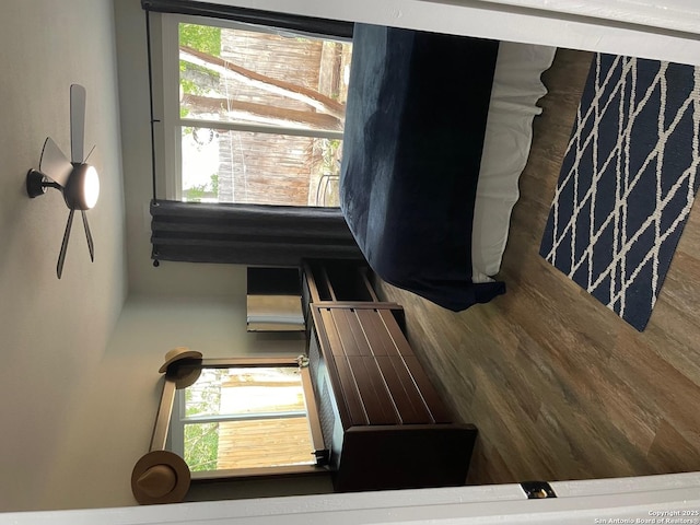 bedroom with wood finished floors