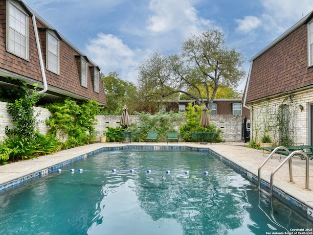 view of pool with a fenced backyard and a fenced in pool