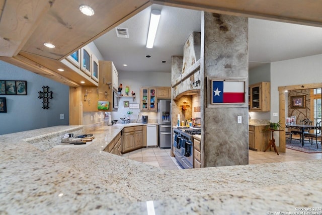 kitchen featuring stainless steel appliances, light tile patterned flooring, visible vents, recessed lighting, and glass insert cabinets