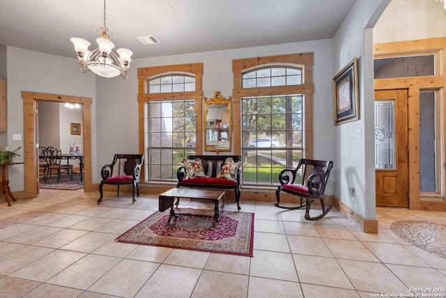 sitting room with baseboards, visible vents, a notable chandelier, and light tile patterned floors