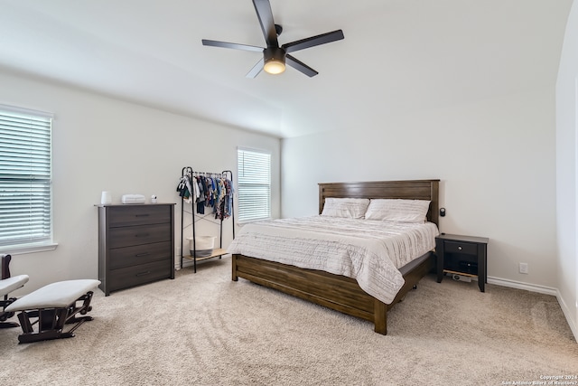 bedroom with baseboards, a ceiling fan, and carpet flooring