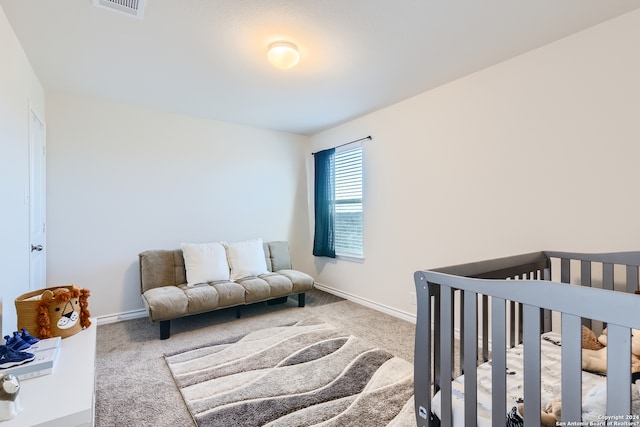 bedroom featuring carpet floors, visible vents, and baseboards