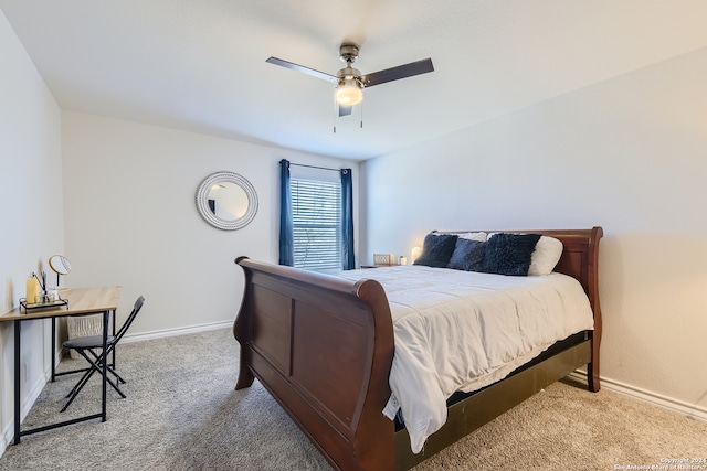 carpeted bedroom with baseboards and ceiling fan
