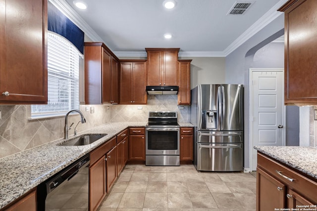 7143 Dulce Mdw, San Antonio, TX 78252 - kitchen with stainless steel appliances, a sink, visible vents, light stone countertops, and under cabinet range hood