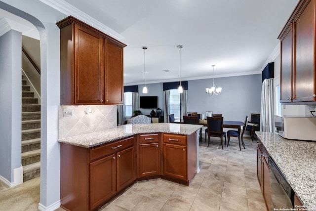 7143 Dulce Mdw, San Antonio, TX 78252 - kitchen featuring a peninsula, a notable chandelier, decorative backsplash, light stone countertops, and decorative light fixtures