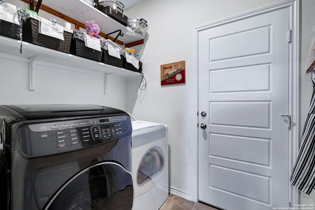 7143 Dulce Mdw, San Antonio, TX 78252 - washroom featuring separate washer and dryer, tile patterned flooring, and laundry area
