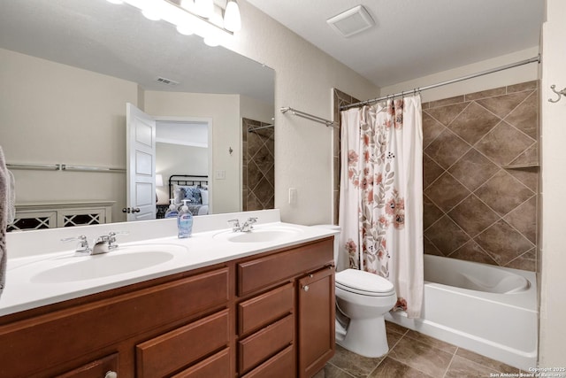 7143 Dulce Mdw, San Antonio, TX 78252 - full bath featuring shower / bath combo with shower curtain, visible vents, a sink, and toilet