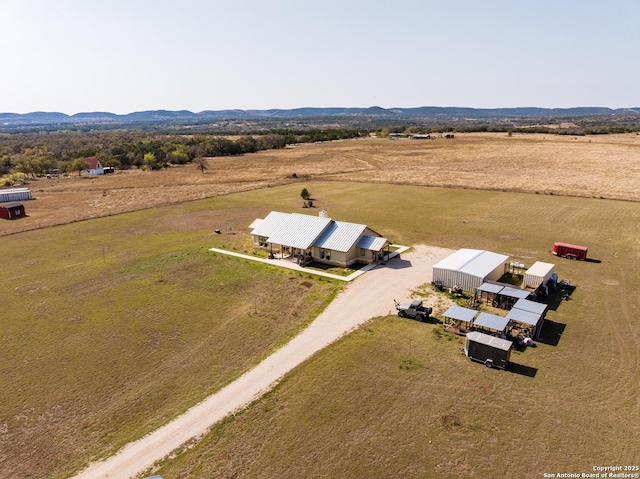 birds eye view of property with a rural view and a mountain view