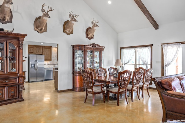 dining space featuring high vaulted ceiling, finished concrete floors, and beam ceiling