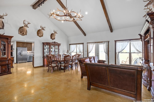 living area with beamed ceiling, a chandelier, a healthy amount of sunlight, and finished concrete floors
