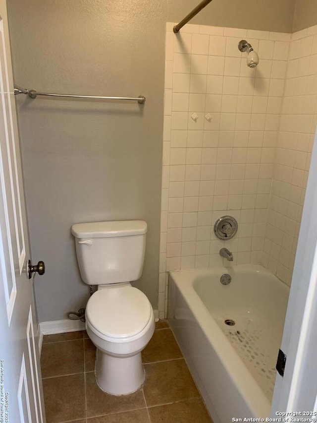 4212 Medical Dr Unit 1201, San Antonio, TX 78229 - bathroom featuring shower / washtub combination, toilet, baseboards, and tile patterned floors