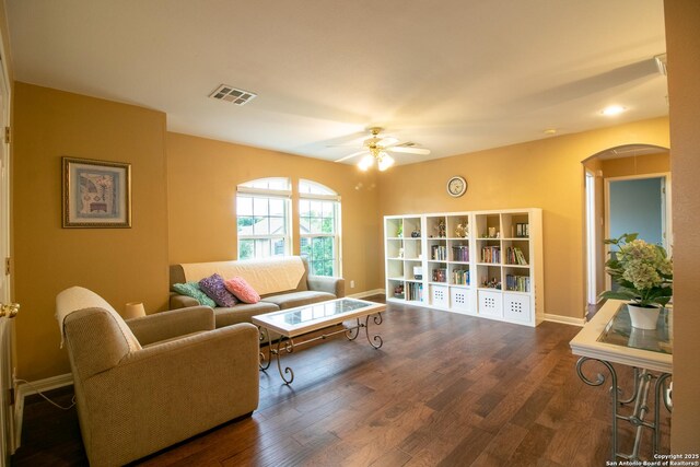 511 Mesa Rdg, San Antonio, TX 78258 - living area featuring ceiling fan, arched walkways, wood finished floors, and visible vents