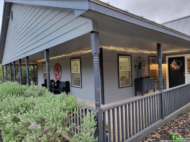 view of property exterior featuring a porch