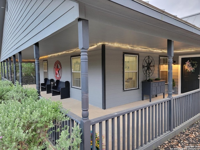 view of property exterior featuring covered porch