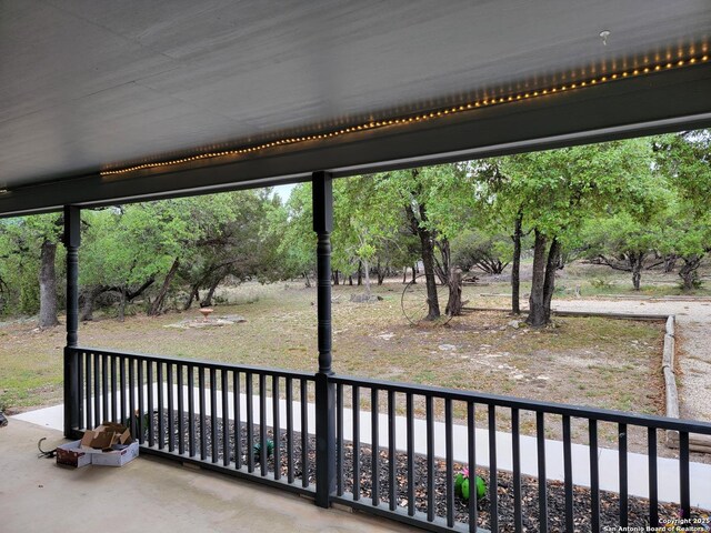 view of patio featuring a balcony
