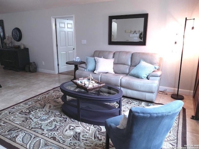 living room featuring tile patterned floors and baseboards