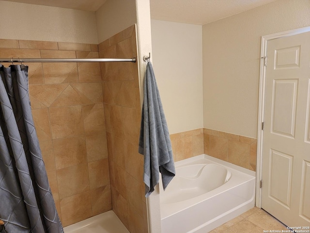 full bathroom with a bath, a tile shower, and tile patterned flooring