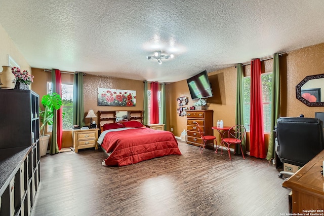5402 Palamon Farm, San Antonio, TX 78228 - bedroom with a textured wall, wood finished floors, and a textured ceiling