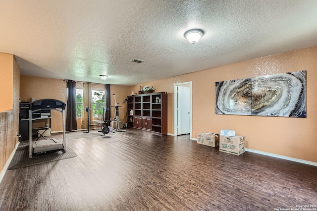 5402 Palamon Farm, San Antonio, TX 78228 - workout area featuring wood finished floors, a textured ceiling, french doors, baseboards, and visible vents