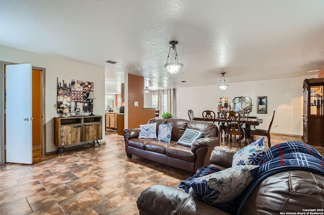 5402 Palamon Farm, San Antonio, TX 78228 - living room featuring visible vents and a textured ceiling