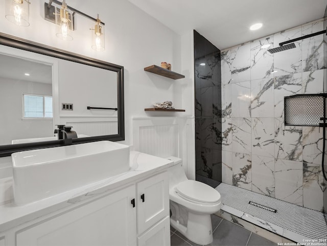 bathroom with a marble finish shower, recessed lighting, vanity, and toilet