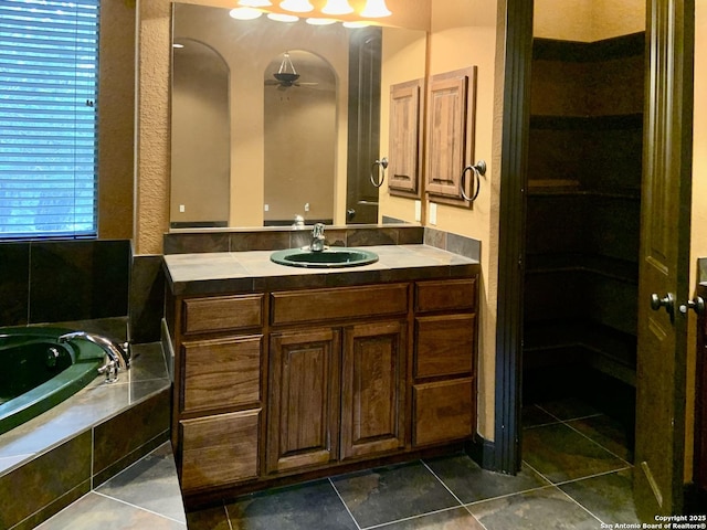 full bath with a garden tub, vanity, tile patterned flooring, and ceiling fan