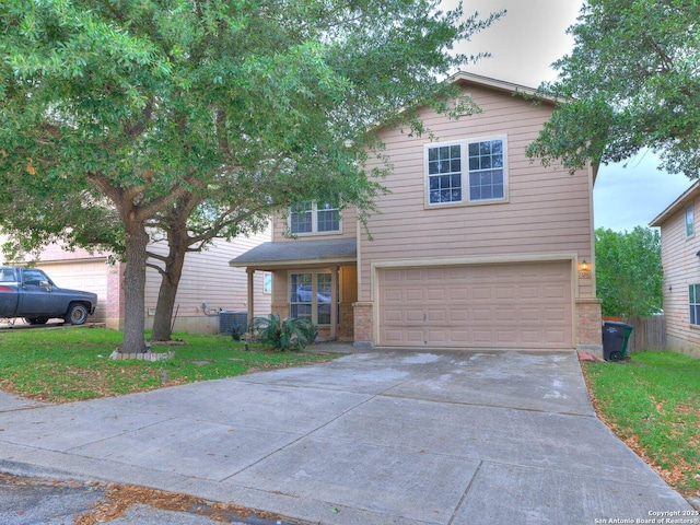 traditional-style home featuring a front lawn, concrete driveway, brick siding, and an attached garage