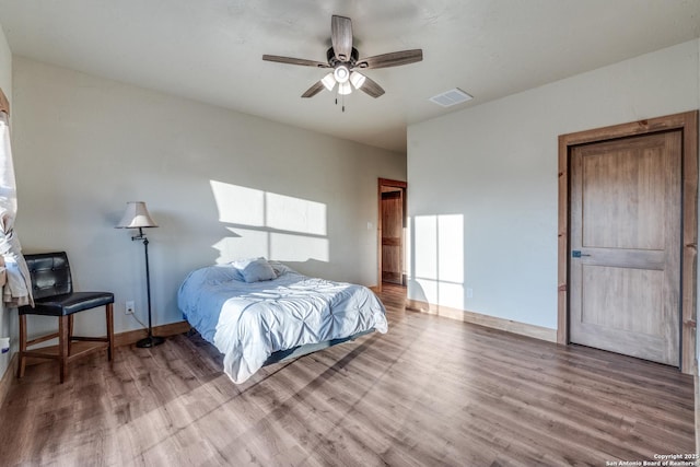 841 Postert, Floresville, TX 78114 - bedroom with wood finished floors, visible vents, and ceiling fan
