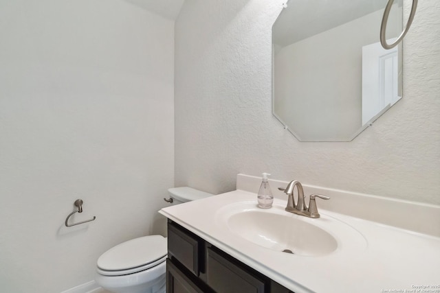 30812 Schlather Ln, Bulverde, TX 78163 - bathroom with toilet, vanity, and a textured wall