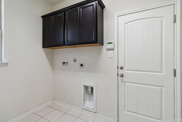30812 Schlather Ln, Bulverde, TX 78163 - washroom featuring hookup for an electric dryer, hookup for a washing machine, cabinet space, baseboards, and light tile patterned floors