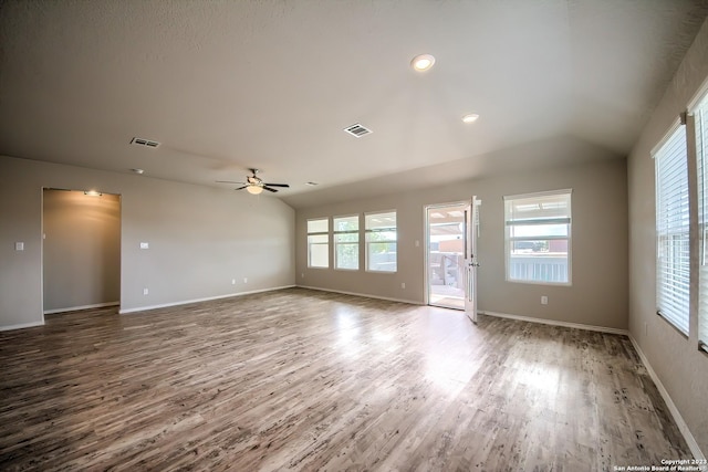 unfurnished living room with wood finished floors, visible vents, and ceiling fan