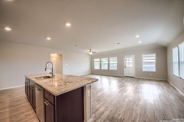 1828 Heather Gln, New Braunfels, TX 78130 - kitchen featuring stainless steel dishwasher, a ceiling fan, a sink, light wood-style floors, and baseboards