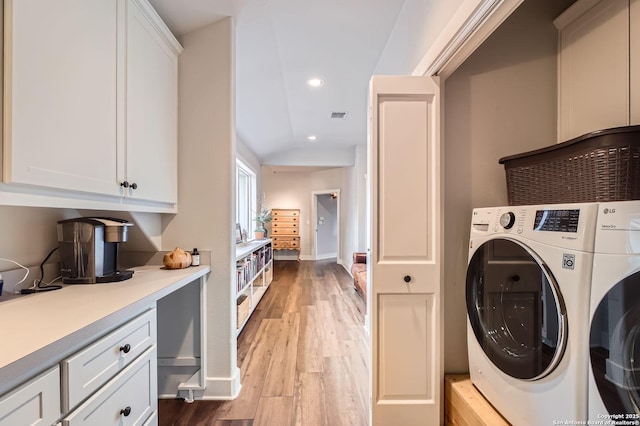 laundry area with washer / dryer, light wood-style floors, visible vents, and recessed lighting